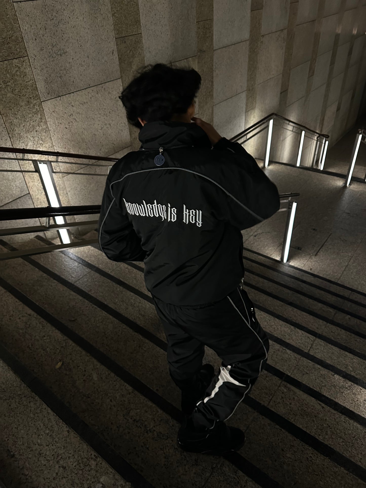 'KNOWLEDGE IS KEY' BLACK NYLON TRACKSUIT
